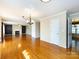 Open concept living area features hardwood floors and a charming fireplace feature at 2316 Highland Park Dr, Charlotte, NC 28269
