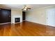 Inviting living room with hardwood floors, fireplace and neutral paint at 2316 Highland Park Dr, Charlotte, NC 28269