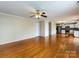 Open-concept living room featuring hardwood floors and views to the kitchen at 2316 Highland Park Dr, Charlotte, NC 28269