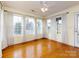 Cozy sunroom featuring hardwood floors, ceiling fan, and multiple windows at 2316 Highland Park Dr, Charlotte, NC 28269