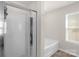 Bathroom featuring a bathtub and a glass enclosed shower at 3119 Auten Ave, Charlotte, NC 28269