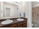Bathroom featuring double sinks and a vanity with a large framed mirror at 3119 Auten Ave, Charlotte, NC 28269