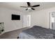Bright bedroom featuring a mounted TV, and an ensuite bathroom at 3119 Auten Ave, Charlotte, NC 28269