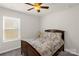 Bright bedroom with a ceiling fan, window, and comfortable bed at 3119 Auten Ave, Charlotte, NC 28269