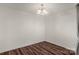 Neutral dining area with contemporary chandelier lighting and hardwood flooring at 3119 Auten Ave, Charlotte, NC 28269