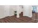 Hardwood floors in the foyer with white doors and neutral paint, creating a welcoming atmosphere at 3119 Auten Ave, Charlotte, NC 28269