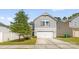 Charming two-story home with gray siding, white trim, and a two-car attached garage at 3119 Auten Ave, Charlotte, NC 28269