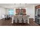 Modern kitchen featuring a spacious island, stainless steel appliances, and dark wood cabinets at 3119 Auten Ave, Charlotte, NC 28269