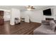 Spacious living room with hardwood floors, fireplace, and sofa, perfect for entertaining guests at 3119 Auten Ave, Charlotte, NC 28269