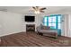 Cozy living room featuring a fireplace, large windows, and a comfortable chaise lounge for relaxation at 3119 Auten Ave, Charlotte, NC 28269