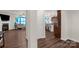 Open-concept living space with a view into the kitchen, dining area and fireplace at 3119 Auten Ave, Charlotte, NC 28269