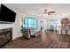 Bright and airy living room with a fireplace, sliding glass doors, and an adjoining dining area at 3119 Auten Ave, Charlotte, NC 28269