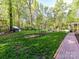 Expansive backyard featuring a chicken coop, garden, and seating area, perfect for outdoor activities and relaxation at 3232 Kale Ln, Matthews, NC 28105