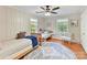 Cozy bedroom featuring twin beds, hardwood floors, and lots of natural light from large windows at 3232 Kale Ln, Matthews, NC 28105