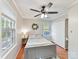 Comfortable bedroom boasts ample closet space, a ceiling fan, and warm hardwood flooring at 3232 Kale Ln, Matthews, NC 28105