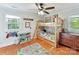 A bedroom with wooden bunk beds and hardwood floors at 3232 Kale Ln, Matthews, NC 28105