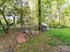 Backyard chicken coop with a brick walking path at 3232 Kale Ln, Matthews, NC 28105