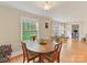 Cozy dining room with natural light, hardwood floors and views of the backyard at 3232 Kale Ln, Matthews, NC 28105