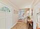Bright and welcoming foyer with tiled floors, paneled walls, staircase, and decorative front door at 3232 Kale Ln, Matthews, NC 28105