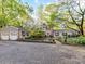 Charming brick home with a well-manicured front yard, mature trees, and an inviting curb appeal at 3232 Kale Ln, Matthews, NC 28105