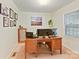 Functional home office space with a large desk, ample lighting, and closet storage at 3232 Kale Ln, Matthews, NC 28105