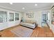 Cozy living room with hardwood floors, a comfortable couch, and French doors leading to another room at 3232 Kale Ln, Matthews, NC 28105