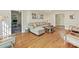 Comfortable living room with hardwood floors, a sectional sofa, and access to the front door at 3232 Kale Ln, Matthews, NC 28105
