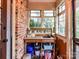 Charming mud room with brick wall, sink, shelving, and plenty of storage space at 3232 Kale Ln, Matthews, NC 28105