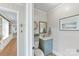 Charming powder room with a vanity, mirror, and neutral décor at 3232 Kale Ln, Matthews, NC 28105