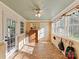 Inviting sun room with brick floors, lots of natural light, and access to the backyard at 3232 Kale Ln, Matthews, NC 28105