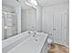 Clean bathroom featuring shower, toilet and vanity with ample lighting at 3357 Ellingford Rd, Charlotte, NC 28214