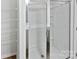 A modern bathroom with a glass-enclosed shower and shelving at 3357 Ellingford Rd, Charlotte, NC 28214