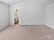 Expansive bedroom with plush carpet and an ensuite bathroom at 3357 Ellingford Rd, Charlotte, NC 28214