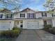 Charming townhouse with well-maintained landscaping, attached garage, and inviting curb appeal at 3357 Ellingford Rd, Charlotte, NC 28214