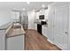 Modern kitchen with stainless steel appliances, granite countertops, and sleek white cabinetry at 3357 Ellingford Rd, Charlotte, NC 28214