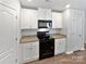 Well-equipped kitchen featuring modern appliances, granite countertops, and stylish cabinetry at 3357 Ellingford Rd, Charlotte, NC 28214