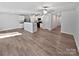 Spacious open-concept living room and kitchen with hardwood floors and stainless steel appliances at 3357 Ellingford Rd, Charlotte, NC 28214