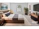 Comfortable main bedroom featuring a serene decor, soft lighting, and attached bath at 3357 Ellingford Rd, Charlotte, NC 28214