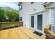 Exterior deck with white siding, a wooden railing, and access to the backyard and house at 390 15Th Ne Ave, Hickory, NC 28601