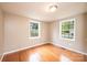 Bright bedroom with hardwood floors and two windows at 390 15Th Ne Ave, Hickory, NC 28601
