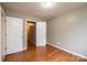 Bright bedroom with wood floors featuring ample closet space at 390 15Th Ne Ave, Hickory, NC 28601