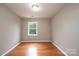 Bright bedroom with neutral walls, window, and hardwood floor at 390 15Th Ne Ave, Hickory, NC 28601