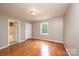 Well-lit bedroom featuring a window, closet, and doorway to a bathroom at 390 15Th Ne Ave, Hickory, NC 28601
