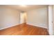 Bright bedroom with wood floors featuring a neutral color palette and ample lighting at 390 15Th Ne Ave, Hickory, NC 28601