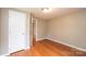 Bright bedroom with wood floors, white trim, and a neutral wall color at 390 15Th Ne Ave, Hickory, NC 28601