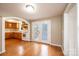 Open dining and kitchen area with hardwood floors and access to the back deck at 390 15Th Ne Ave, Hickory, NC 28601
