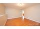 Bright living room featuring hardwood floors and neutral paint, offering a versatile space at 390 15Th Ne Ave, Hickory, NC 28601