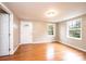Well-lit living room featuring beautiful hardwood floors and two windows at 390 15Th Ne Ave, Hickory, NC 28601