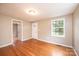 Bright living room with hardwood floors, a large window, and neutral paint at 390 15Th Ne Ave, Hickory, NC 28601