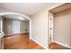 Open-concept living space showcasing hardwood floors, neutral walls, and easy access to other rooms at 390 15Th Ne Ave, Hickory, NC 28601
